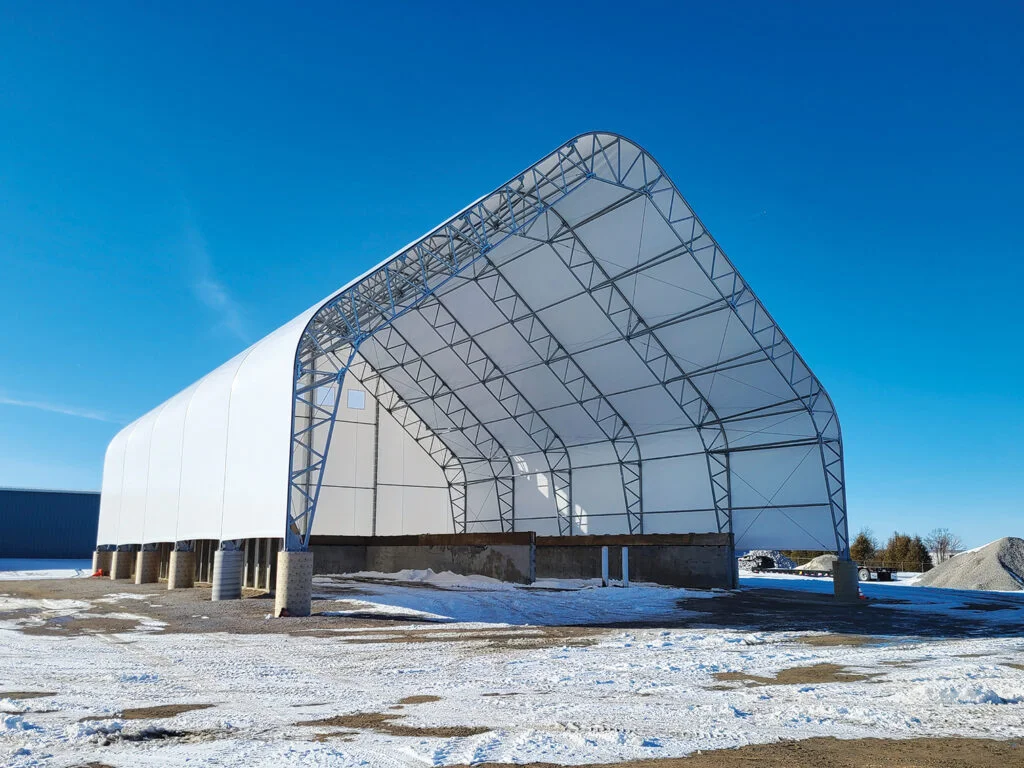 Fulton County Greystone Ohio Department of Transportation ODOT - Britespan 80 by 120 foot Britespan Magnum fabric salt storage building for Fulton County Ohio with truss piers outside the bunker walls